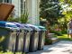 Home trash bins in a tidy outdoor setting.